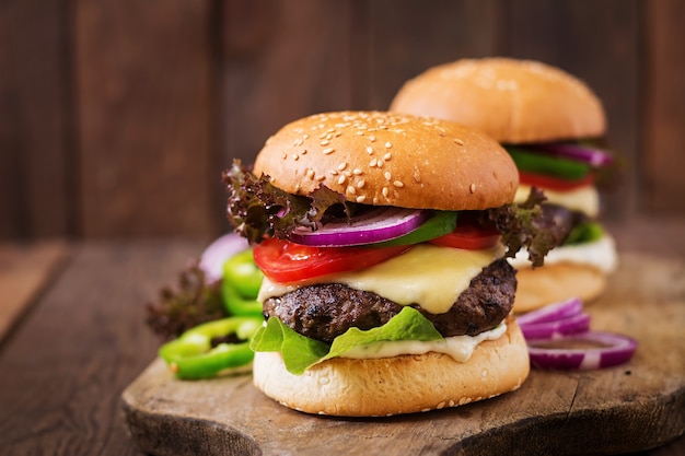 Big sandwich - hamburger burger with beef, cheese, tomato and tartar sauce