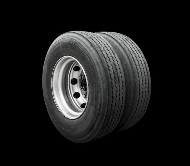 Big Semi Truck Wheels Tires Isolated on Black. Rubber, Truck Tyres. Freight Trucks Transport