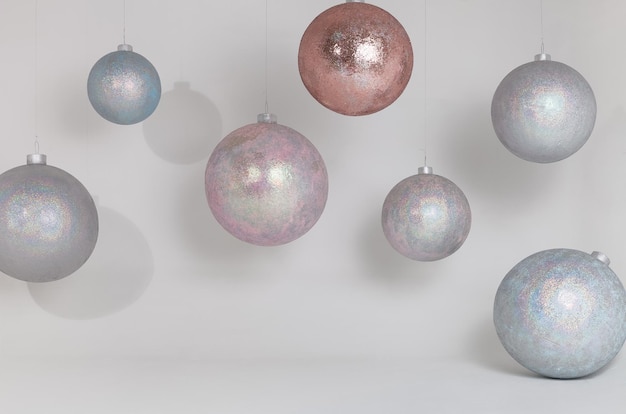 Big shinny disco balls or Christmas decorations on white wall background