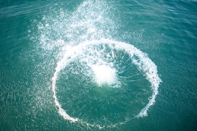 Big splash in lake water view from above