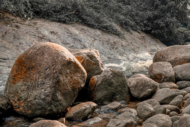 Big stone and small river nature background