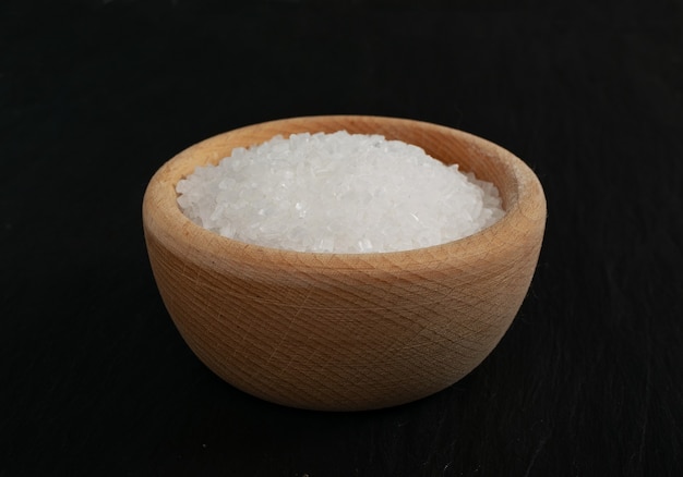 Big sugar crystals in wooden bowl