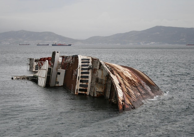 Big sunken ship Mediterranean Sky shipwreck off the coast of Greece at cloudy day