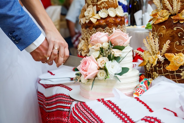 Big sweet wedding cake for newlyweds