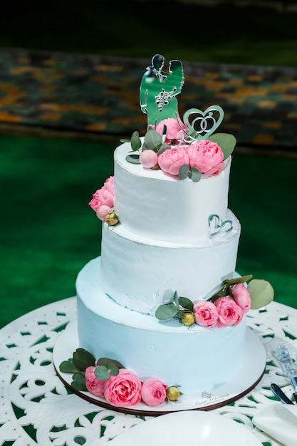 Big sweet wedding cake for newlyweds
