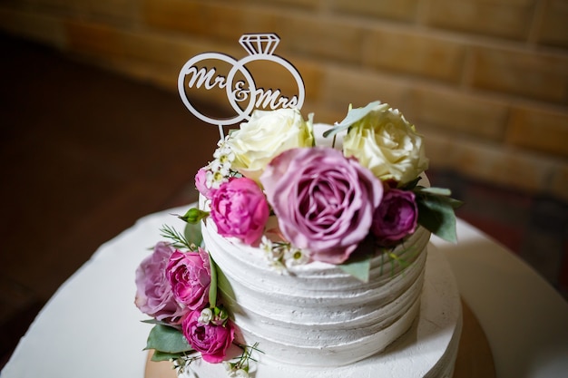 Big sweet wedding cake for newlyweds