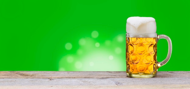 Big traditional glass of bavarian beer at oktoberfest in munich