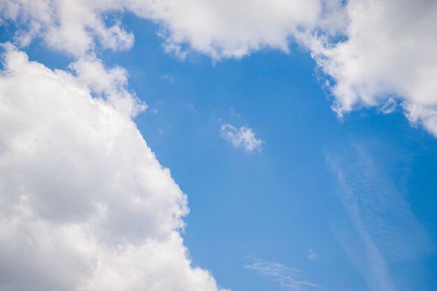 Big white clouds on the blue sky, copy space for text