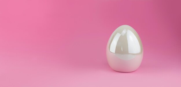 Фото Большое белое мерцающее пасхальное яйцо современный элемент декорации для пасхи на розовом фоне