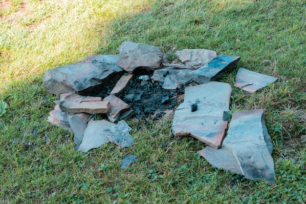 Big wild fireplace with stones on a meadow burnt heat lawn\
outside recreation relax romance scenery trip warm wilderness\
comfort extinct scene hike