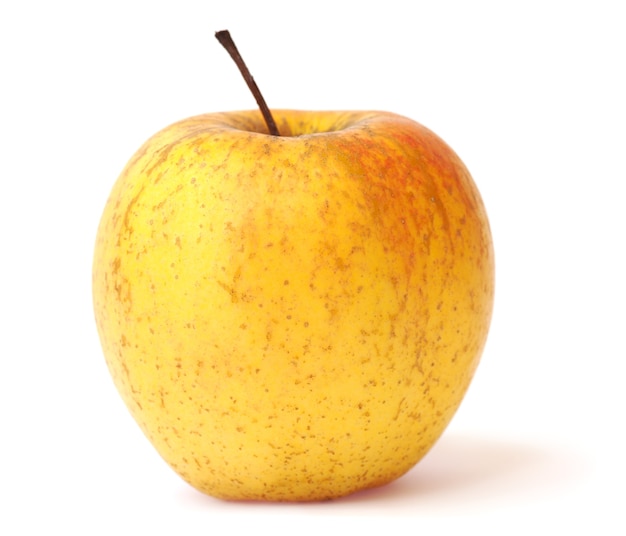 白で隔離される大きな黄色のおいしいリンゴ