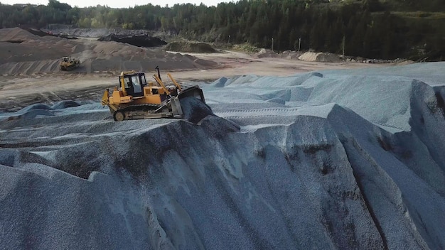 Big yellow excavator working in gravel quarry stock footage professional mining industry concept