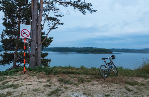 Bike on the lake shore after sunset