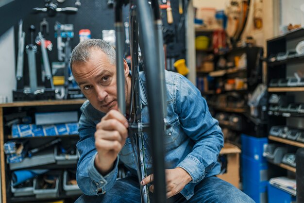 Bike mechanic repairing a wheel 