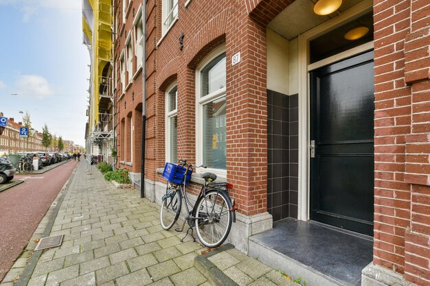 A bike parked outside of a brick building