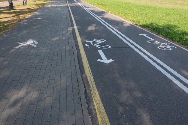 Bike path with a Bicycle sign and a sidewalk with a pedestrian sign