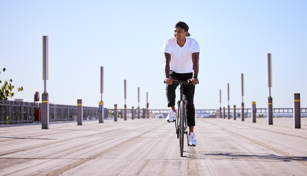 A bike ride a day keeps the doctor away Shot of a young man riding a bike on a sunny day