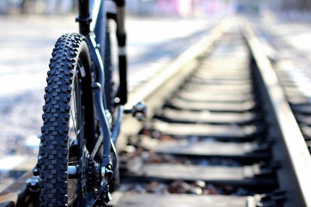 The bike stands on a railway