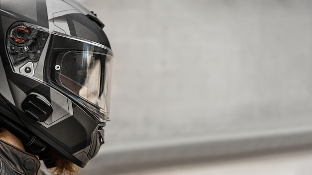 Biker in helmet profile photo empty space to insert