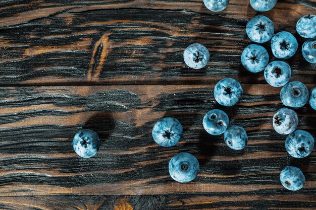 Bilberries on vintage wooden board