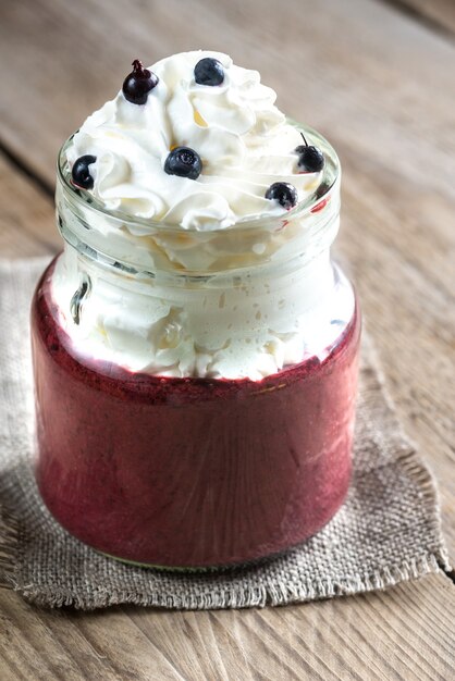 Bilberry smoothie with whipped cream