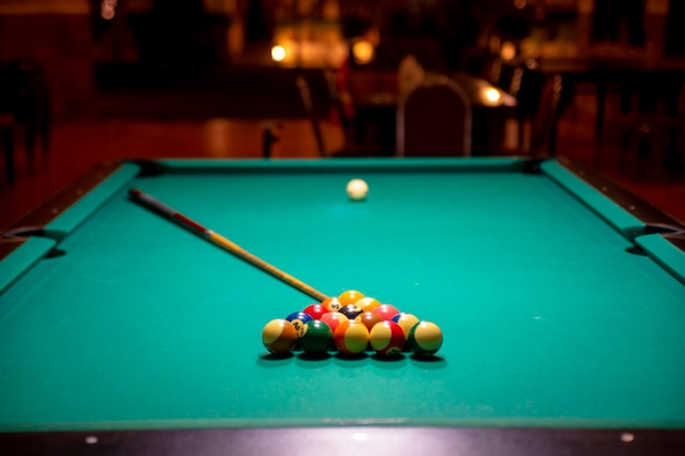 Biliard Table with balls and cue