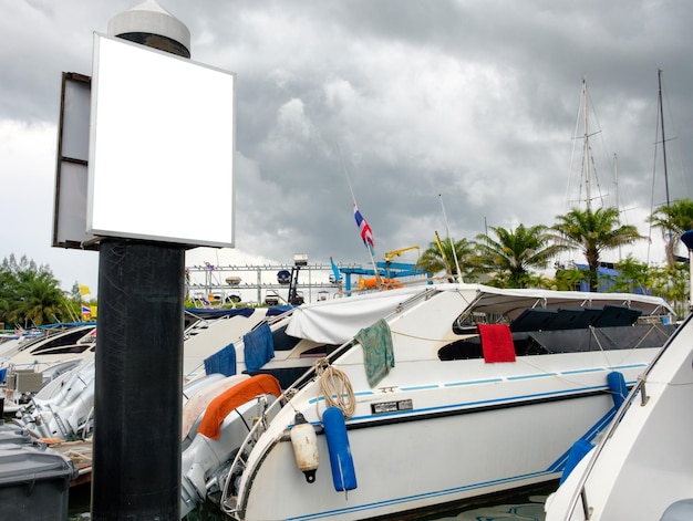 Billboard banner with speedboat on marina