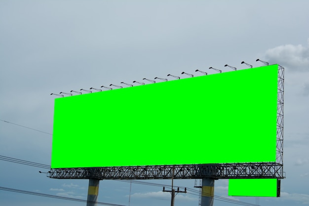 Billboard blank and blue sky, copy space on green screen