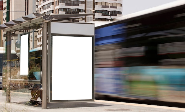 Billboard in the city center with moving bus