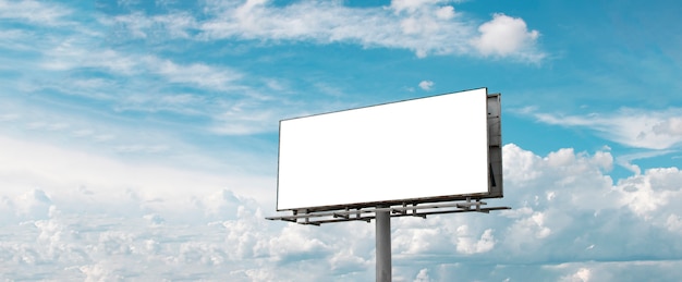 Billboard - Empty billboard in front of beautiful cloudy sky in a rural location