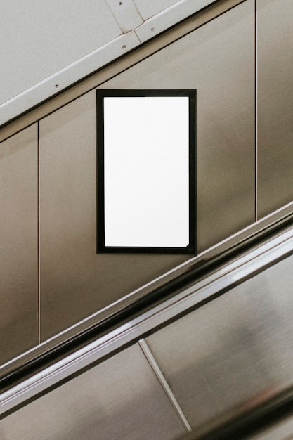 Billboard screen by underground escalator