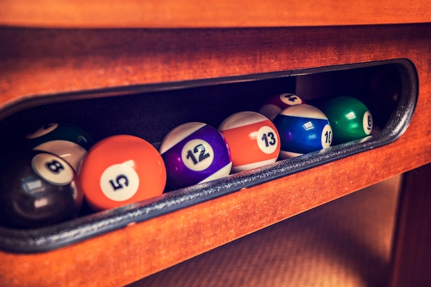 Billiard balls cued in the table