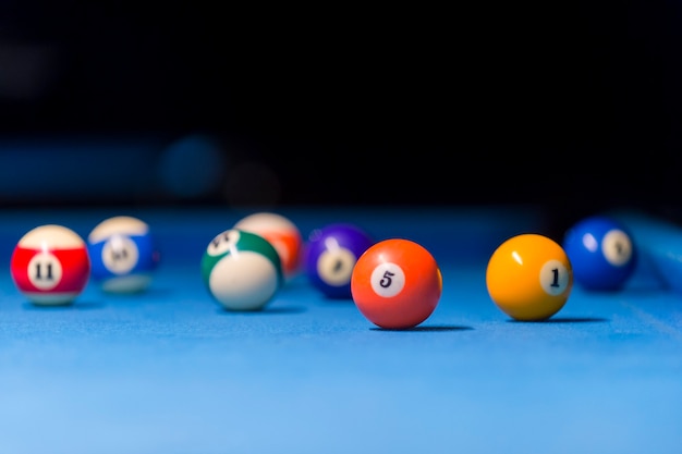 Photo billiard balls on pool blue table