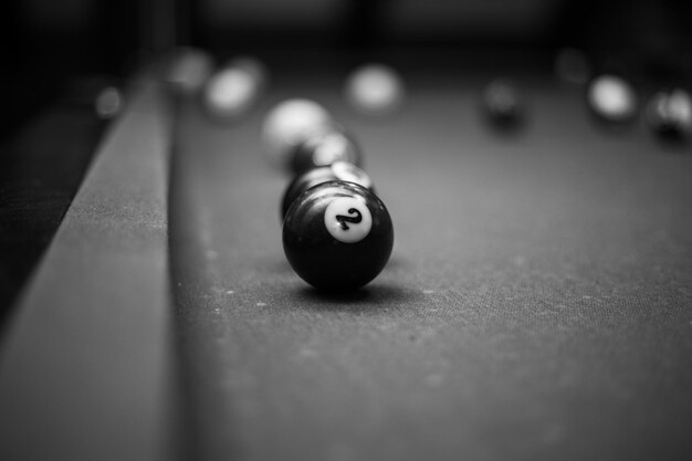 Billiard table in the billiard room with balls and cue