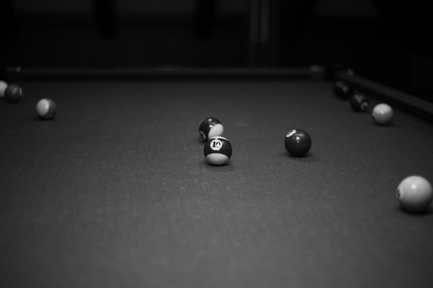 Billiard table in the billiard room with balls and cue