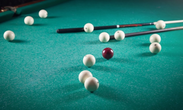 Billiard on table. Cue and balls