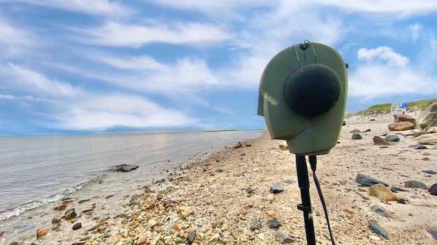 Photo binaural head microphone recording soundscapes on cape cod bay
