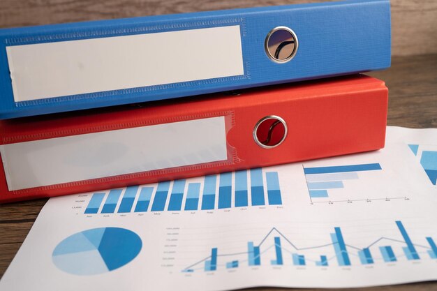 binder data finance report business with graph analysis in office.