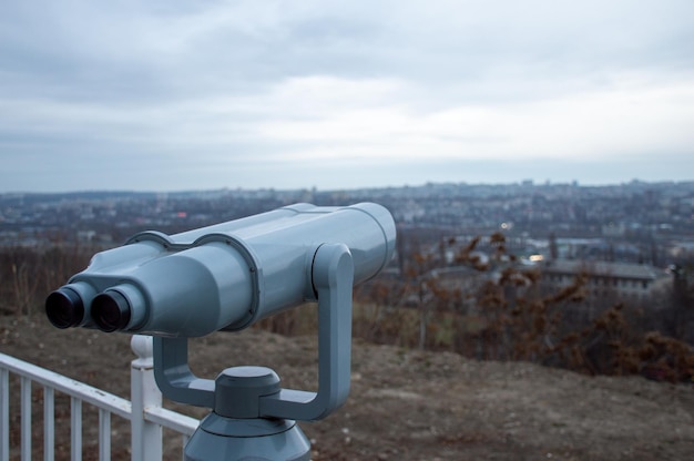 Binoculars, view of the city from a height