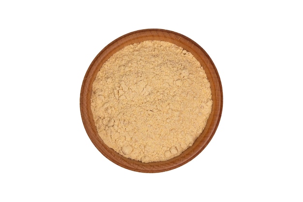 Bio organic dried ginger powder in wooden bowl isolated on white background