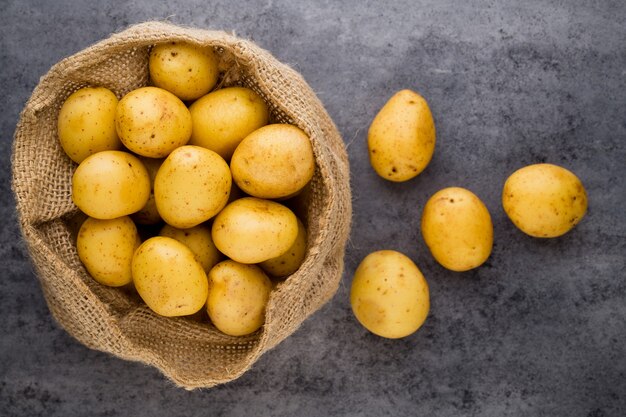 A bio russet potato wooden vintage background.