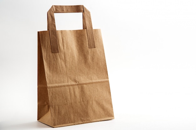 Biodegradable environmentally friendly cardboard bag on white isolated background