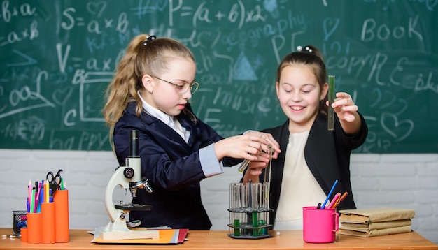 Biological samples. science experiments in laboratory. biology lab. successful teamwork. little girls in lab. teamwork. chemistry research in lab. little scientist teamwork with microscope