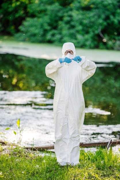 Biologist working on water analysis ecology and environmental
pollution concept