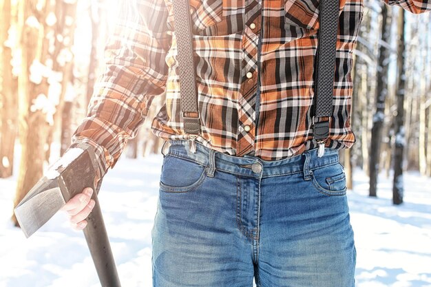 Birch winter forest man with axe