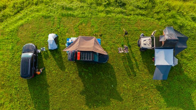 Bird eye view of campers camping with roof top tent on their Four Wheel Drive vehicles