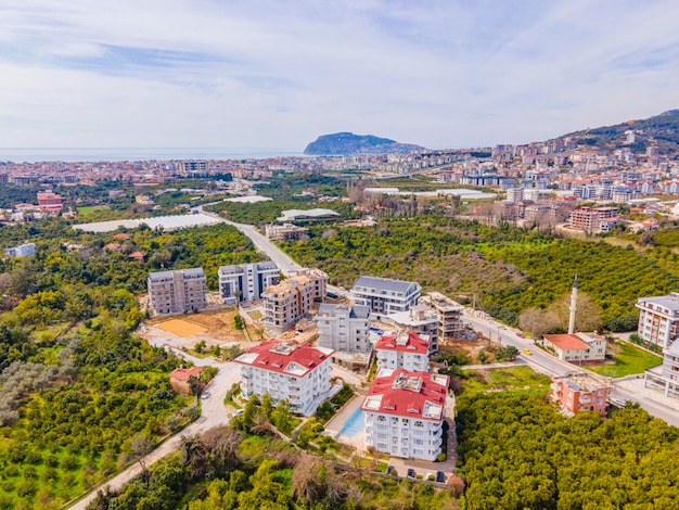 A bird's eye view of a residential area with a mountain in the background