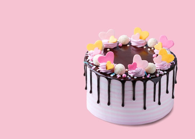 birthay cake decorated with pink and yellow hearts isolated copyspace