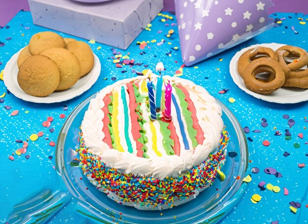 Birthday cake on party background