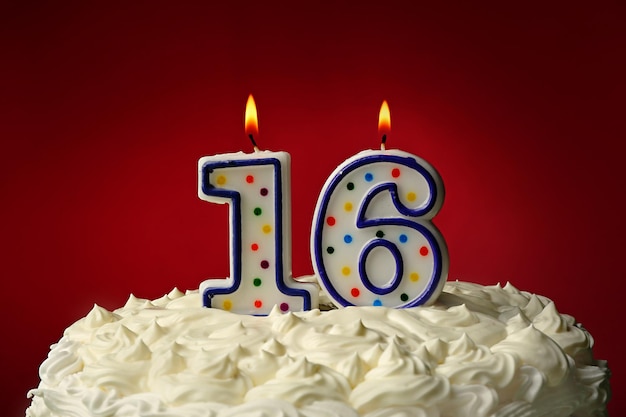 Birthday cake with candles on color background